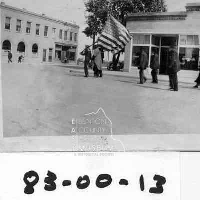 Armistice Day Parade, Looking east from the corner of Kennewick Ave. and Washingotn St. shows armed forces in marching formation with city hall/library behind.