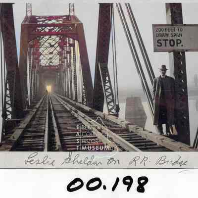 Leslie Sheldon on railroad bridge
