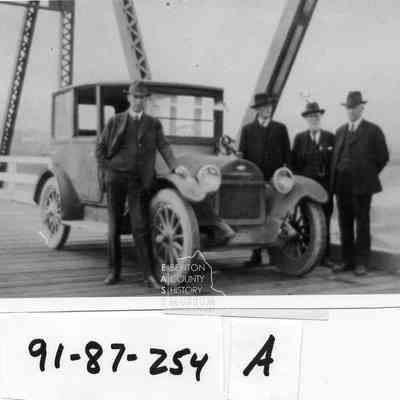 The first car across the Pasco-Kennewick (Green) Bridge. L/R Senator Jones, Senator stinson of Pasco, D.W. Owen of Kennewick, unkown.