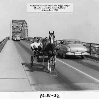 The Pasco, Kennewick "Horse and Buggy Bridge" with Glenn C. Lee, Tri-City Herlad Publisher, the Driver is unkown.