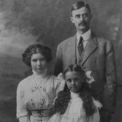 Delbert and Alice Amon and their young daughter Formal Family portrait