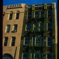          Color slide of detail view of row house façades, pilasters and fire escape on buildings at an unidentified location picture number 1
   