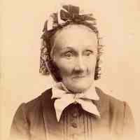 Digital image of photo of an older woman posed in photo studio, Prag or Praha, no date, circa 1870-1890