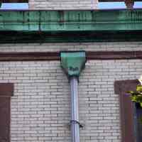          57: detail cornice and drain pipe, south wing, west facade
   