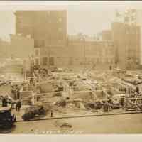 Sepia-tone photo of progress in foundation construction on the site for the Fabian Theatre, Newark & Washington Sts., Hoboken, Jan. 9, 1928.