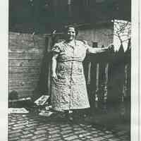 Black-and-white photocopy of photo of Philomina Ratti in the backyard of 721 Adams St., Hoboken, 1942.