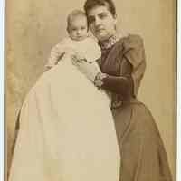 Cabinet photo of a woman & baby (related to Great-Grandmother Lancy) posed in photographer