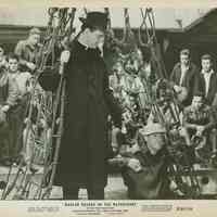 B+W photo, movie still, from "On the Waterfront" showing Karl Malden talking to longshoremen in the hold of a ship, copyright 1959.