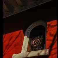 Color slide of close-up view of stained glass widow on a building at Hudson and 5th