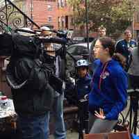 Color photos, 6, of Lucy Walkowiak and charging station set-up to benefit Hurricane Sandy victims, Hoboken, Oct. 31, 2012.