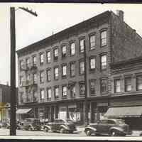 B&W photo of mixed-use row house apartment building at 142-146 Pavonia Avenue, Jersey City.