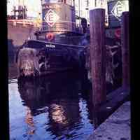 Color slide of a two tug boats at a dock.