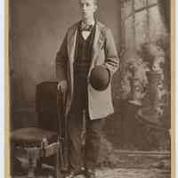 Cabinet photo of young man posed in photographer