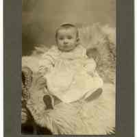 Photo of baby posed on fur throw, possible Sanntrock family member (of Hoboken) posed in photographer