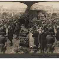 Stereoview: 14334 Americans glad to be home - awaiting trains for demobilization camp, Hoboken. Underwood & Underwood. N.d., ca. 1919-1920.