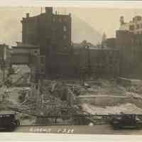 Sepia-tone photo of foundation preparation and concrete forms on the north end of the site for the Fabian Theatre, Hoboken, Jan 3, 1928.