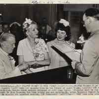 B+W photo of Pat Rooney II & Janet Reade being married in Hoboken City Hall, July 21, 1942.