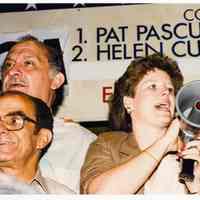 Color photo of mayoral candidate Tom Vezzetti with supporters in front of his campaign headquarters on election night, Hoboken, [June 11, 1985].