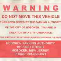 Warning notice of immobilization and parking violation summons placed on immobilized vehicle for parking violation, Hoboken, July 11, 2003.