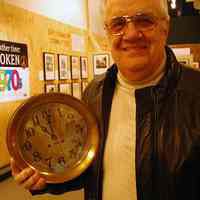 Digital images, 2, of Harold Lilienthal with ship