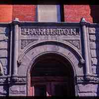 Color slide of detail view of portico frieze reading "HAMILTON", semicircular arch and transom window at 803 Washington between 8th and 9th