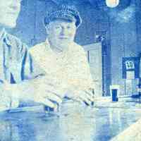 Digital image of photo of two men with caps at a bar, no place (probably not Hoboken), no date, circa late 1910-1920.