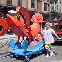 Digital image of a lobster float and woman in clown costume for Sequicentennial Parade, Hoboken, April 16, 2005.