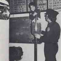 Reference image of printed photo image of a child on a fire house pole from pg 28 of archives catalog 2002.026.0002, Hoboken, ca. 1975.