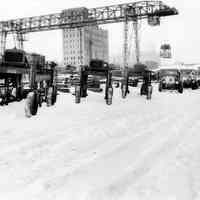 Color copy photo of b+w photo of a winter view of the Lawson & Macmurray Lumber Co., ca. 11th St. & Hudson River, Hoboken, no date, ca. 1934-35.