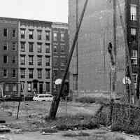 B+W photo of several old apartment buildings, some abandoned, street unknown, Hoboken, N.J., no date (ca. 1968-1972).