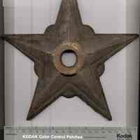 Three 5-point star-shaped wall reinforcement plates reported to be from Bethlehem Steel Shipyard, Hoboken.