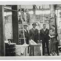 Photograph of the Interior of the Hoboken Individual Laundry with three men and a woman