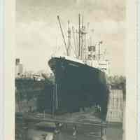 B+W photo of a port bow view of the S.S. Exemplar of the American Export Lines in dry dock (3 or 4?) at the Bethlehem Steel Shipyard, Hoboken Division