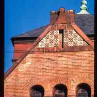          Color slide of detail view of gable brickwork, decorative tile, gauged arches and stained glass windows on the First Baptist Church at 901 Bloomfield on the corner of Bloomfield and 9th picture number 1
   