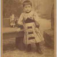 Cabinet photo of ca. 3-4 year old boy in ethnic dress posed in studio, Hoboken, n.d., ca. 1885-1895.