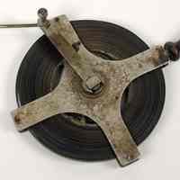          side with crank handle (open position)
   