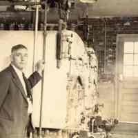 Digital image of photo of Julius Durstewitz, far background, in boiler room, Hoboken Recreation Center, 113 Jefferson St., n.d., ca. 1938.