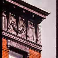 Color slide of detail view of cornice, brackets, frieze and window heads at 1029 Willow on the SE corner with 11th