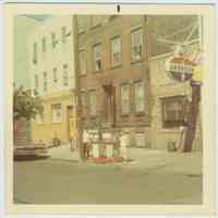          Color photo of 2 boys standing at gas pumps at Joe's Auto Repair, 219 Clinton St., Hoboken, no date, ca. 1990. picture number 2
   