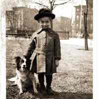 Sepia-toned photo of a young boy 3 years old with dog taken in Elysian Park, Hoboken, no date, ca. 1920-1922.