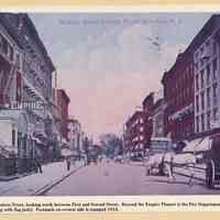 Printed view of a color postcard of Hudson Street looking north between First and Second Sts., Hoboken, 1914 or earlier.