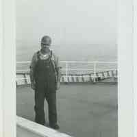          B+W photo of Charlie Kosbab on an upper deck of an unidentified vessel, no date, ca. 1965-70. picture number 1
   