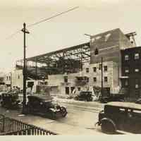 Sepia-tone photo of steel frame erection & fireproof stage house for the Fabian Theatre, Newark & Washington Sts., Hoboken, March 12, 1928.