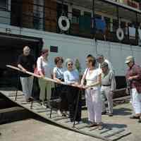 Color photos, 9, of people attending a brunch aboard the ferry "Yankee" moored at pier 12, Hoboken, June 5, 2007.