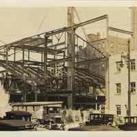 Sepia-tone photo of steel frame erection & fireproof stage house for the Fabian Theatre, Newark & Washington Sts., Hoboken, March 12, 1928.