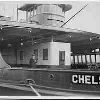 B+W photo of the ferry "Chelsea" with three people on deck at a Hoboken shipyard, no date, ca. 1940.