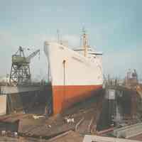 Color photo of the S.S. Independence in dry dock no. 2 at the the Bethlehem Steel Shipyard, Hoboken Division, no date (ca 1960.)