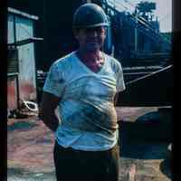 Color slide of a man in a hard hat.