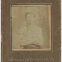 Sepia-tone photo of an unidentified young man posed in studio, Hoboken, no date, ca. 1900-1910.