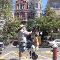Digital photos, 29, of artist Frank Hanavan working on a painting of 921 Hudson Street, Hoboken, August 25, 2005.